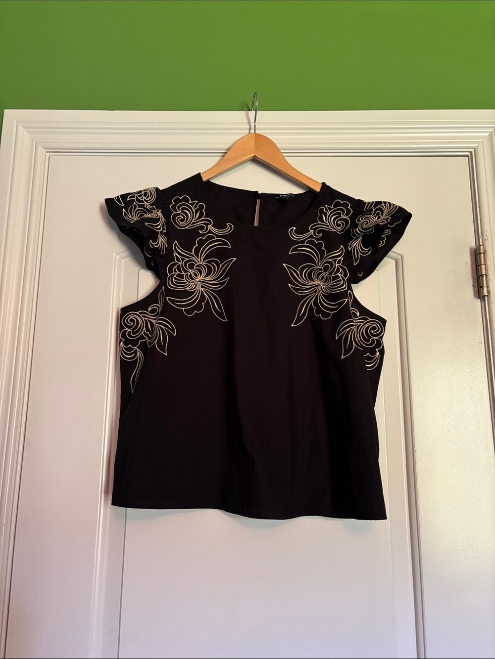 Express Black Top with Tan Floral Embroidery. Size Medium.